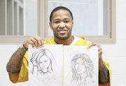 Sherod Jones displays sketches he has drawn to express himself at the Richmond Justice Center.