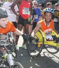 Colin Egan #3219 and Ronnie Nickerson #3253 at the starting line at the Broad Street Mile. Thousands took part in the second annual Virginia Commonwealth University Broad Street Mile on Saturday. The event included a street festival, a 5K run and a series of 1-mile fun runs. It raised more than $1.7 million for more than 600 charities. Location: West Broad Street near Belvidere Street.