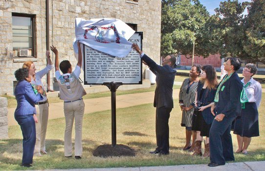 Girl scouts and dignitaries representing Girl Scouts of the Commonwealth of Virginia unveil a historic marker on the campus of Virginia Union University commemorating the first Southern African American Girl Scout Troop that began on the campus in 1932.  