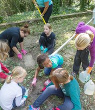 Commonwealth of Virginia Girl Scouts CEO Viola Baskerville along with Girl Scout members spruce up at East End Cemetery one of four cemeteries at  Evergreen. 