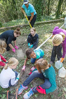 Commonwealth of Virginia Girl Scouts CEO Viola Baskerville along with Girl Scout members spruce up at East End Cemetery one of four cemeteries at  Evergreen. 