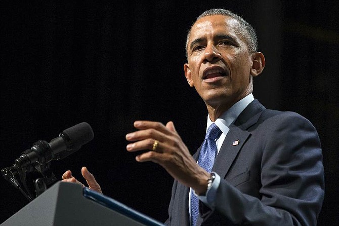 President Barack Obama speaks about the economy, Thursday, Oct. 2, 2014, at Northwestern University in Evanston, Ill. Obama is looking to frame the closing economic arguments of the midterm campaign. (AP Photo/Evan Vucci) 
