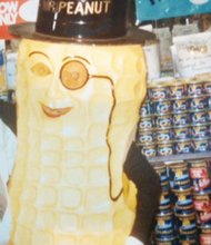 Jack J. Pollard Jr. poses in his first store, The Peanut Shoppe at 2nd and Broad streets, with the Planters’ icon, Mr. Peanut. Mr. Pollard’s son, Daryl, was wearing the costume and entertained customers in the shop.