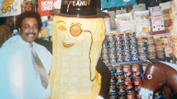 Jack J. Pollard Jr. poses in his first store, The Peanut Shoppe at 2nd and Broad streets, with the Planters’ icon, Mr. Peanut. Mr. Pollard’s son, Daryl, was wearing the costume and entertained customers in the shop.