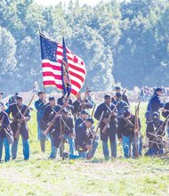 Re-enactment at historic New Market Heights, historic battle took place Sept. 29-30, 1864. Its significance: Fourteen members of the U.S. Colored Troops, from five different regiments, were awarded the Medal of Honor for actions during the battle.