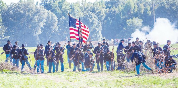 Re-enactment at historic New Market Heights, historic battle took place Sept. 29-30, 1864. Its significance: Fourteen members of the U.S. Colored Troops, from five different regiments, were awarded the Medal of Honor for actions during the battle.