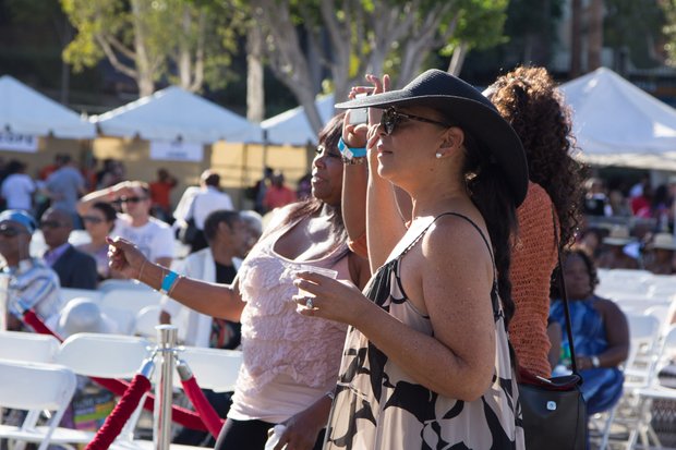 Onlookers get into the beat as the Michael Ward Band performs during the IBEW Local 18 and Baldwin Hills Crenshaw Union Jobs Expo and Celebration which also featured Masta and the Edge of Soul and honored graduates of the IBEW Local 18 & Utility Pre-Craft Training Program.