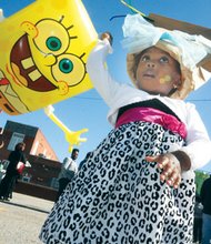Leoné Brunswick parties Saturday with balloon character SpongeBob SquarePants at the 26th annual 2nd Street Festival in Jackson Ward. Thousands of people turned out to enjoy the two-day festival.