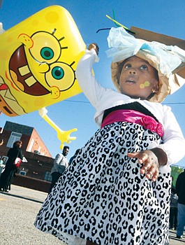 Leoné Brunswick parties Saturday with balloon character SpongeBob SquarePants at the 26th annual 2nd Street Festival in Jackson Ward. Thousands of people turned out to enjoy the two-day festival.