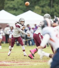 VUU quarterback Kenneth Graham fires off a pass at Hovey Field during the homecoming game against Lincoln University.