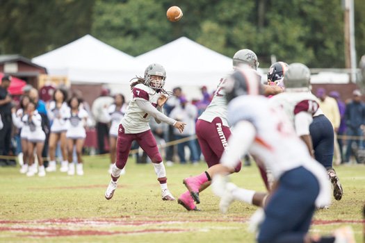 VUU quarterback Kenneth Graham fires off a pass at Hovey Field during the homecoming game against Lincoln University.