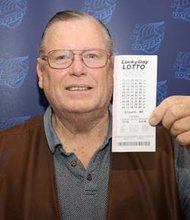 Robert Ewers of Plainfield is $200,000 richer after buying a winning Lucky Day Lotto ticket at a Speedway gas station in Shorewood.