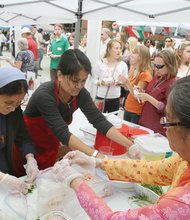 Music and food from around the world were among the attractions at the International Food Festival sponsored recently by the Cathedral of the Sacred Heart. From left, Sister Maria; Be Be Tran, president of the Richmond Vietnamese Association; and Thu Le Pham, a retired Hanover County French teacher, roll fresh Vietnamese spring rolls for the crowd’s enjoyment. Proceeds from the event will benefit various Catholic missions in Richmond. Location: 800 block of Cathedral Place near Virginia Commonwealth University’s Monroe Park Campus.