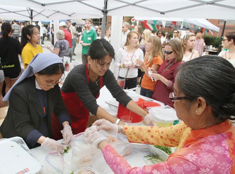 Music and food from around the world were among the attractions at the International Food Festival sponsored recently by the Cathedral of the Sacred Heart. From left, Sister Maria; Be Be Tran, president of the Richmond Vietnamese Association; and Thu Le Pham, a retired Hanover County French teacher, roll fresh Vietnamese spring rolls for the crowd’s enjoyment. Proceeds from the event will benefit various Catholic missions in Richmond. Location: 800 block of Cathedral Place near Virginia Commonwealth University’s Monroe Park Campus.