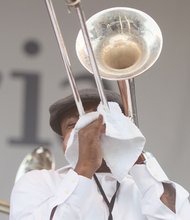 A member of the Bailey Hummingbirds Gospel Brass Band blows his trumpet.