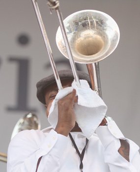A member of the Bailey Hummingbirds Gospel Brass Band blows his trumpet.