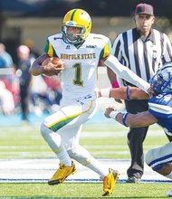 Norfolk State University quarterback Terrance Ervin leads the Spartans to a 21-13 win over Hampton University. 