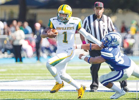 Norfolk State University quarterback Terrance Ervin leads the Spartans to a 21-13 win over Hampton University. 