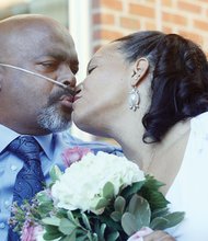 Kent A.P. Smith and Karla Booker seal their union with a kiss Monday. The couple married at Virginia Commonwealth University’s Massey Cancer Center, where Mr. Smith is being treated for a brain tumor and lung cancer.