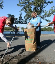 City Council member Parker Agelasto shovels dirt from a road at Byrd Park in the West End. Margaret Quay and Aretha Gayle joined him last Saturday in the HandsOn Greater Richmond citywide cleanup effort. Volunteers teamed in nearly 60 projects to beautify neighborhoods in the annual event.