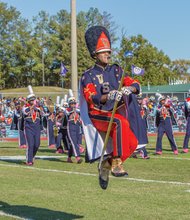 VSU drum major Samuel Jones of Hampton flies high as the band performs. 