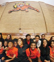 Coach Michele Drayton enjoys being back with her players and assistant coach Wade Ellegood in the Albert H. Hill Middle School gymnasium Tuesday.