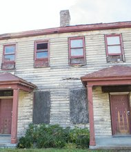 This is a view of the decaying property Montoya D. Phipps bought from the City of Petersburg for $5,000 and recently sold for $50,000. Location: 530-32 Fleet St., just across the Appomattox River from Virginia State University.