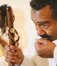 J. Ron Fleming is overcome with emotion during the pouring of libations.