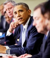 President Barack Obama, center, speaks during his meeting with elected officials, law enforcement officials and community and faith leaders in Washington, D.C., Dec. 1, 2014.