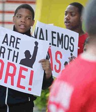 A new minimum wage was approved Tuesday in Chicago, where fast food workers and activists demonstrated outside McDonald's downtown restaurant this summer. 