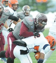 VSU quarterback Tarian Ayres gets sacked — one of six — during the second-round NCAA playoff game against the Bloomsburg State University Huskies in Pennsylvania. 