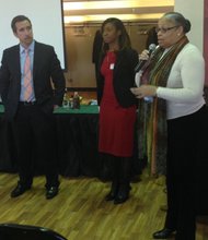 L-R Mike Hyzy, Crisp! Business Director and Santrice Martin, Health Equity Director, American Heart Association listen as Ald. Deborah Graham (29th Ward)  speaks about the food deserts within the Austin community.  Located on the city's west side, the Austin community is one of 29 communities that have been designated as food deserts by the American Heart Association.  