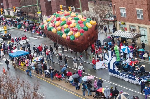 A colorfully decorated fruitcake balloon, sponsored by the Science Museum of Virginia, has a commanding presence along the parade route. 