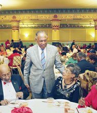 The host, Mayor Dwight C. Jones, greets partygoers at the Mayor’s Senior Holly Ball. Location: The ballroom in the Altria Theater.