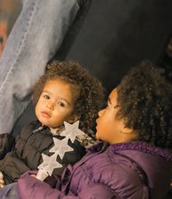 Two-year-old Olivia Cheek, left, and Aliyah Cheek, 5, are dazzled by the lights at the James Center Downtown during the 30th annual Grand Illumination last Friday.