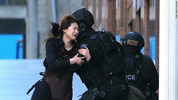 Chilling images from local media showed people, believed to be hostages, with their hands pressed against the glass of the ... Chilling images from local media showed people, believed to be hostages, with their hands pressed against the glass of the ...