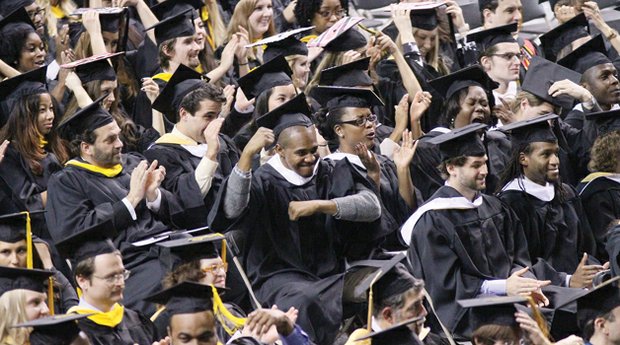 Virginia Commonwealth University students celebrate during the fall commencement ceremonies Saturday at the Siegel Center. 