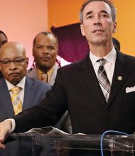Delegate Joe Morrissey of Henrico County addresses the congregation Sunday at New Kingdom Christian Ministries in Highland Park as the church’s pastor, the Rev. Leonidas Young II, left, listens. Rev. Young, a former Richmond mayor, served time in prison after being convicted in 1999 of fraud and influence peddling.
