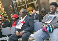 John Burnley, left, lost his daughter, Juanita Burnley, to homicide in 2007. Mr. Burnley attended the memorial with his grandson, Quinton Washington, right, Ms. Burnley’s son.