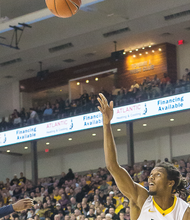 Virginia Commonwealth University guard Doug Brooks lunges to put up a shot during the Rams’ lopsided 84-60 victory over East Tennessee State University on Monday at the Siegel Center. The win improved the Rams’ record to 8-3.