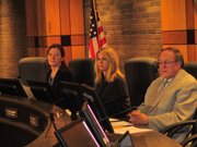 The Joliet Electoral Board, made up of Joliet City Clerk Christa Desiderio and council members Jan Quillman and Mike Turk, listen to statements made by Councilwoman Bettye Gavin and her political opponent James Foster.
