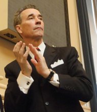 Henrico Delegate Joseph D. "Joe" Morrissey joins in applauding visitors Wednesday to the General Assembly. He is facing potential sanctions from his colleagues in the House as the result of his conviction last month of contributing to the delinquency of a minor.