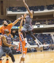 Avery Jirmnson unleashes a shot for Virginia Union University, but he and the rest of the Panthers could not halt Virginia State University from trouncing them by 19 points in this annual contest and keeping them winless in CIAA conference play.