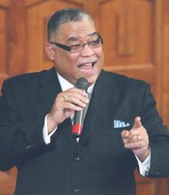 Dr. Peter D. Wherry urges audience members at Monday’s Citywide Mass Meeting to persevere despite obstacles.