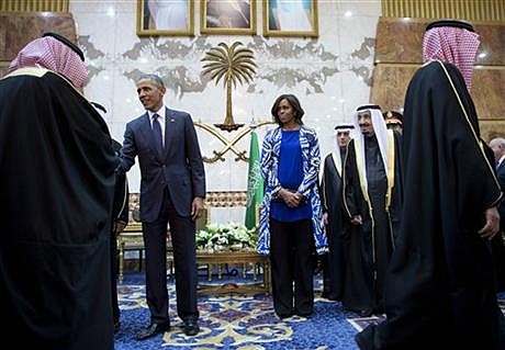 President Barack Obama and first lady Michelle Obama participate in a delegation receiving line with the new Saudi Arabian King, Salman bin Abdul Aziz, in Riyadh, Saudi Arabia, Tuesday, Jan. 27, 2015. The president and first lady have come to express their condolences on the death of the late Saudi Arabian King Abdullah bin Abdulaziz al-Saud. (AP Photo/Carolyn Kaster)