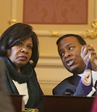 Virginia State Senators Rosalyn R. Dance of the 16th District (Petersburg) and Kenneth C. Alexander of the 5th District (Norfolk) chat in the Senate Chamber before the opening of the 2015 session of the General Assembly on Jan. 14, 2015. 