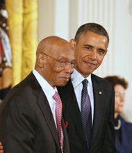 President Obama awards the Presidential Medal of Freedom to baseball Hall of Fame player Ernie Banks at a White House ceremony in November of 2013.