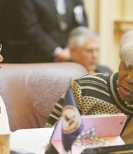 Virginia State Senators Mamie Locke of the 2nd District (Hampton) and L. Louise Lucas of the 18th District (Portsmouth) chat in the Senate chamber before the opening of the 2015 session of the General Assembly on Jan. 14, 2015.