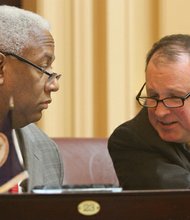 
Virginia State Senators A. Donald McEachin of the 9th District (Henrico) and R. Creigh Deeds of the 25th District (Charlottesville) chat in the Senate Chamber before the opening of the 2015 session of the General Assembly on Jan. 14, 2015.