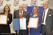 Wendell Scott’s children bask in the glory of their father’s posthumous induction into the NASCAR Hall of Fame during a ceremony Jan. 31 in Charlotte, N.C. They are, from left, Sybil Scott, Wendell Scott Jr., Deborah Davis and Franklin Scott.